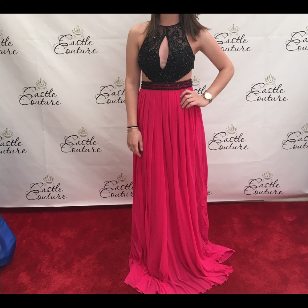 A black embroidered top and hot pink prom dress